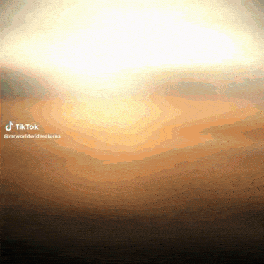 a tiktok video of a sunset with the words mrworldwidereturns at the bottom