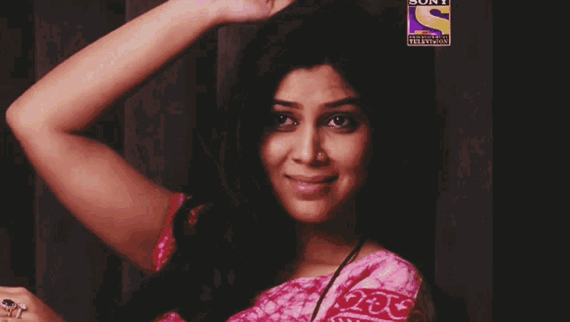 a woman with a sony television sticker on her hair