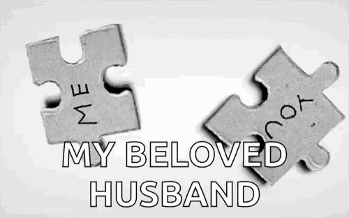 a couple of puzzle pieces with the words `` my beloved husband '' written on them