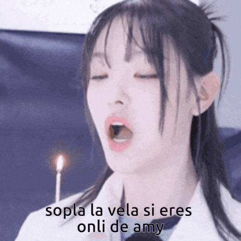 a girl is blowing out a birthday candle and says sopla la vela si eres onli de amy .