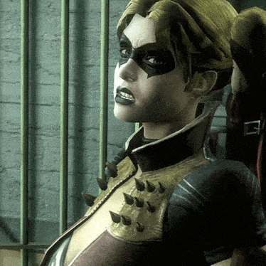 a close up of a woman 's face with spikes on her chest