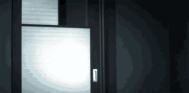 a sliding glass door with a handle on the side
