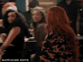 two women are dancing in a crowded room with the words sunflower edits on the bottom