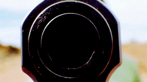 a close up of a black object with a circle in it