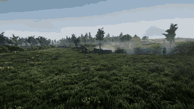 a group of people standing in a field with smoke coming out of it
