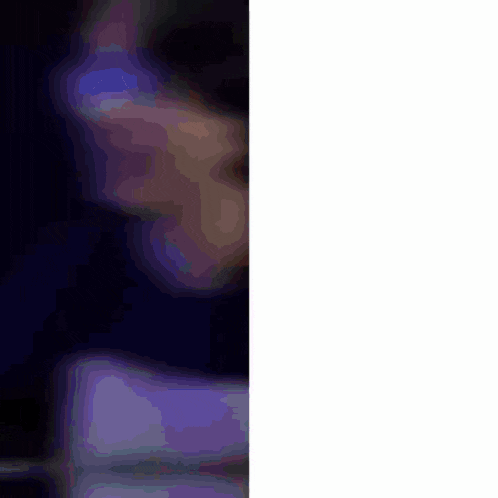 a man sitting at a table with the words tell me i 'm like behind him