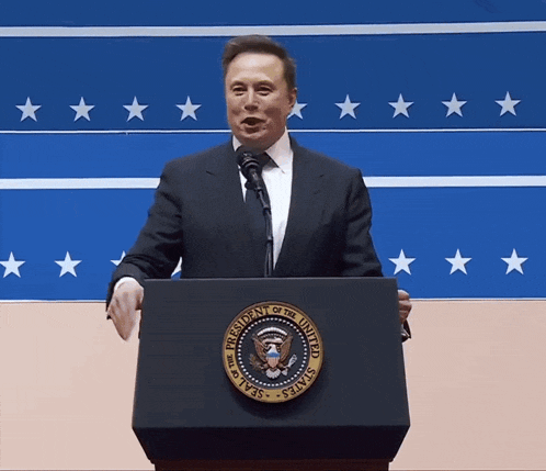 a man stands behind a podium with the seal of the president of the united states on it