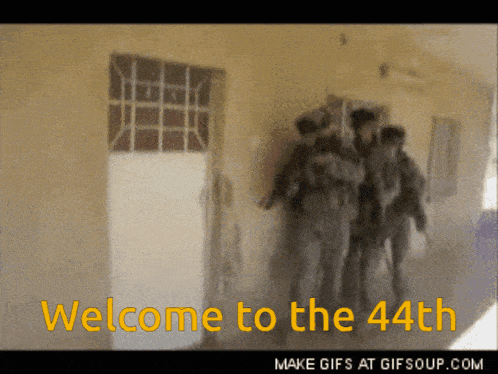 a group of soldiers are walking down a hallway with the words welcome to the 44th in yellow letters