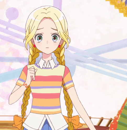 a girl with blonde hair is wearing a colorful striped shirt and earrings