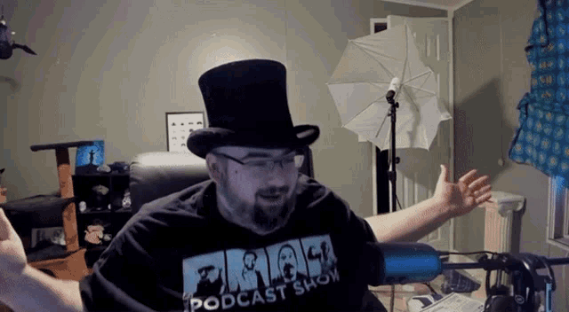 a man wearing a top hat and a shirt that says podcast show on it