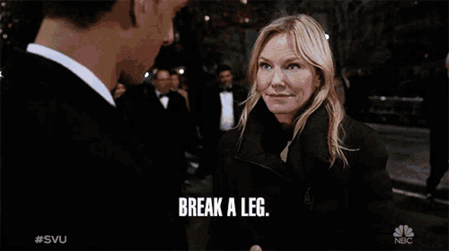 a woman talking to a man with the words break a leg written on the screen