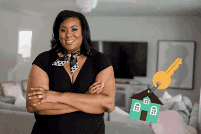 a woman stands with her arms crossed in front of a key and a house