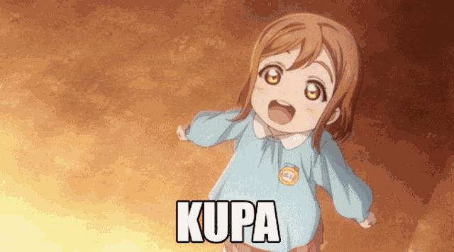 a little girl in a blue shirt with the word kupa on it