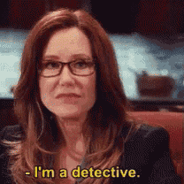 a woman wearing glasses says i 'm a detective