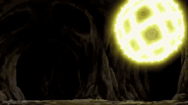 a dark cave with a yellow light coming out of the top