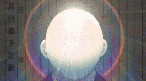 a close up of a bald man 's head with a glowing circle around it .