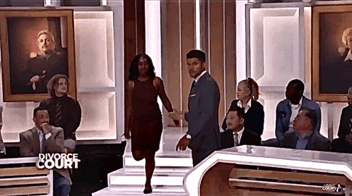 a man and woman on a divorce court show holding hands
