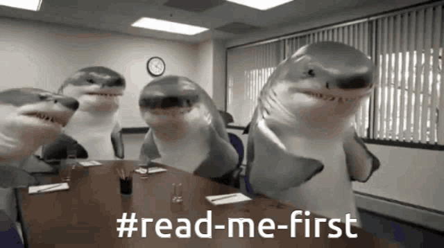 a group of sharks standing around a table with the hashtag #read-me-first on the bottom