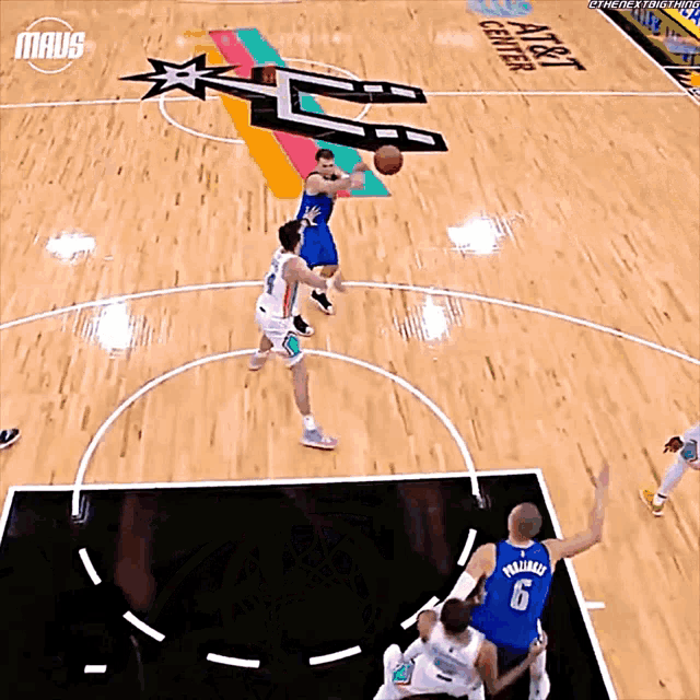 a basketball game is being played at the at & t center in dallas