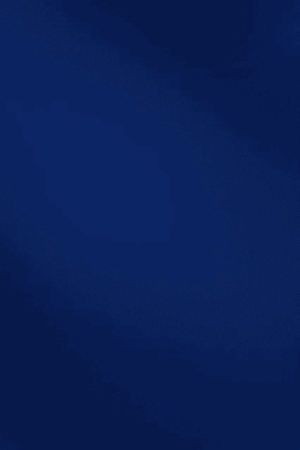 a close up of a dark blue background with a gradient .