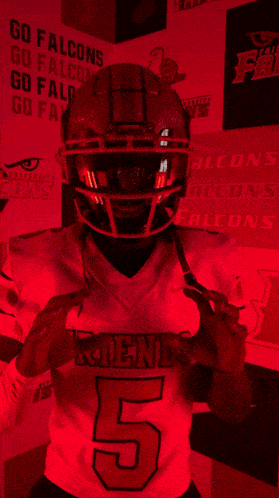 a football player wearing a jersey that says friends 5