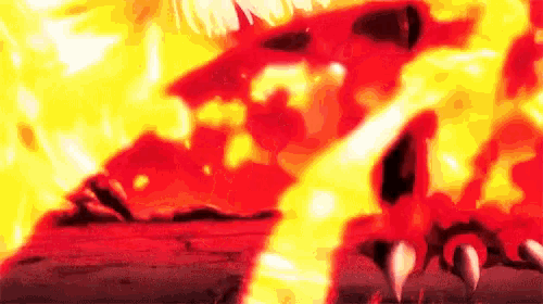 a close up of a person standing in front of a fire with their mouth open .