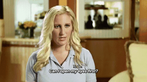 a blonde woman in a blue shirt is asking can i open my eyes first .
