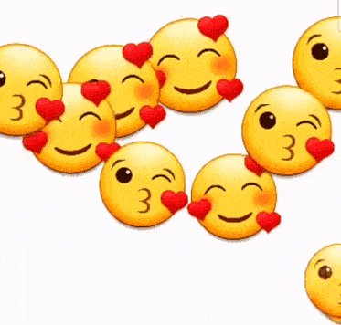 a bunch of yellow smiley faces with red hearts on them