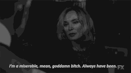 a black and white photo of a woman saying i 'm a miserable mean goddamn bitch