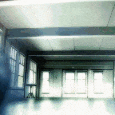 a room with lots of windows and a table