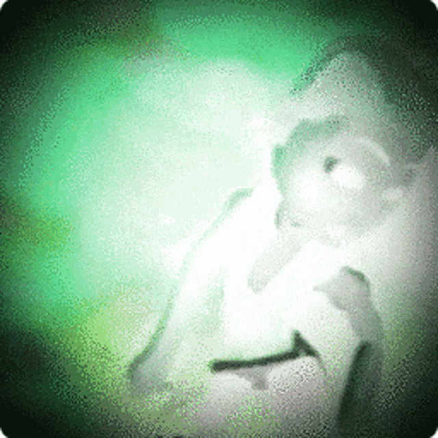 a green and white image of a person with a beard