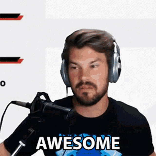 a man wearing headphones and a black shirt with the word awesome on it