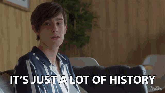 a young man sitting on a couch with the words it 's just a lot of history