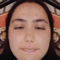 a close up of a woman 's face with eyes closed