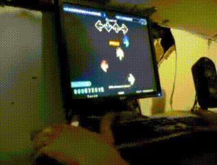 a person playing a video game on a dell computer monitor