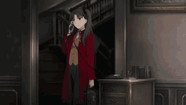 a woman in a red coat talking on a phone