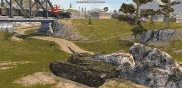 a video game screen shows a train going under a bridge and a tank in the foreground