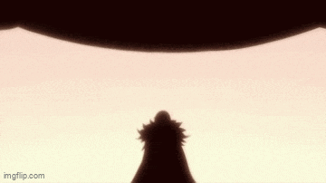 a silhouette of a person standing in front of a large object in the air .