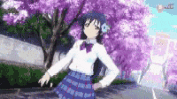 a girl in a plaid skirt is dancing in front of a cherry blossom tree .