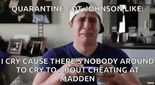 a man is crying in a living room with a caption that says quarantine got johnson like