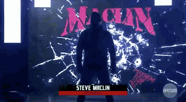 steve maclin is standing in front of a wall with the word mayhem on it