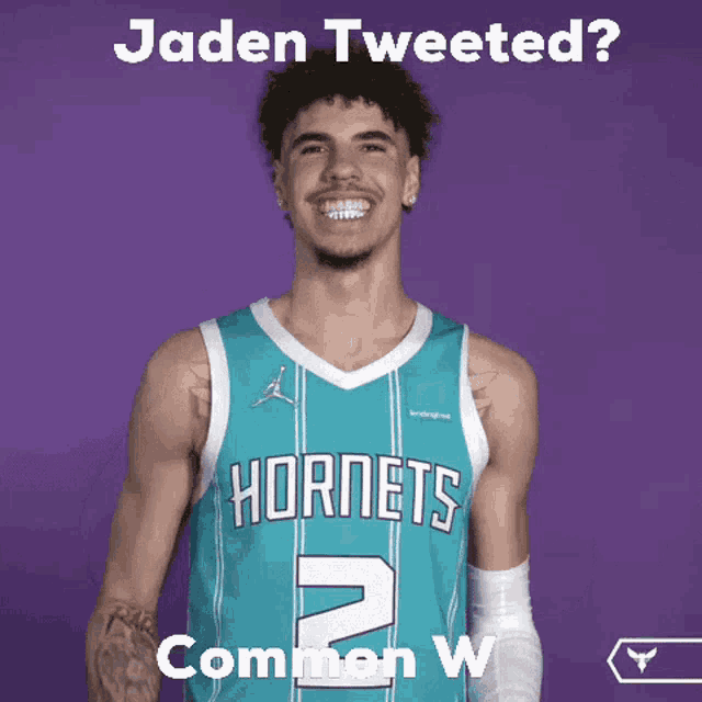 a basketball player with hornets 2 on his jersey