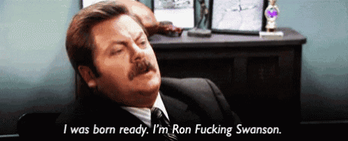a man in a suit and tie says i was born ready i 'm ron fucking swanson .