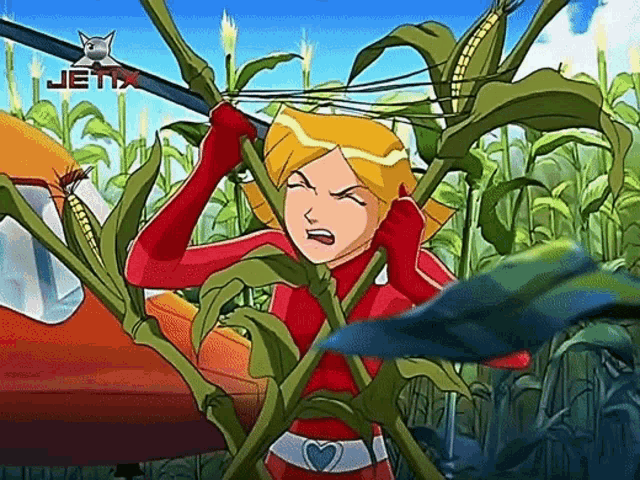 a cartoon character from jetix is standing in a field of plants