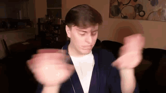 a man in a robe is dancing in a living room .