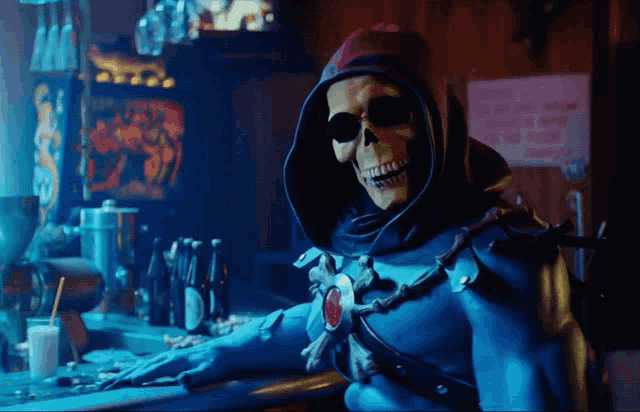 a skeletor is sitting at a bar with a sign that says no smoking