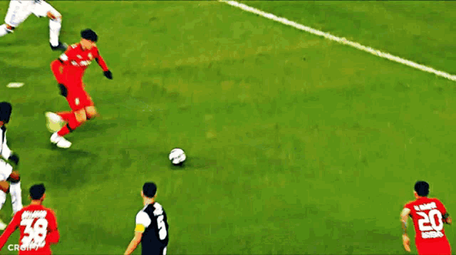a soccer game is being played in front of a mastercard banner