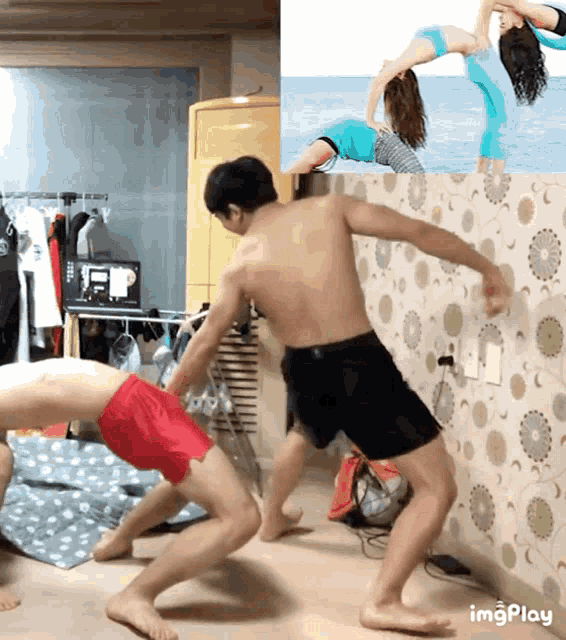 a man in red shorts is doing a handstand next to another man