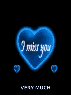 a blue heart with the words `` i miss you very much '' written inside of it