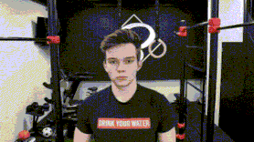 a young man wearing a drink your water t-shirt